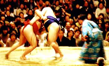 Two sumo wrestlers lock in battle